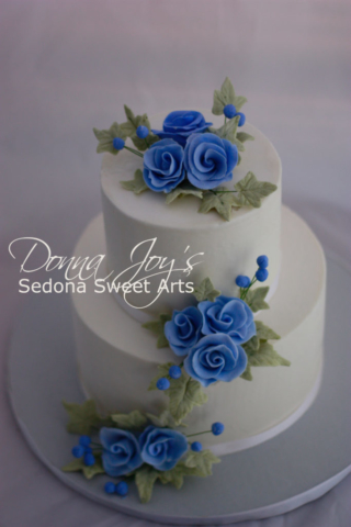 Blue Cascade sugar flower on a smooth Buttercream wedding cake