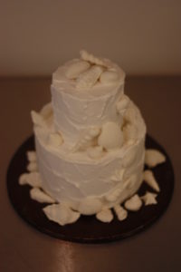 Stormy Love, textured Buttercream Wedding Cake by Donna Joy ~ Sedona Sweet Arts. Handmade White chocolate seashells adorn this beautiful cake.