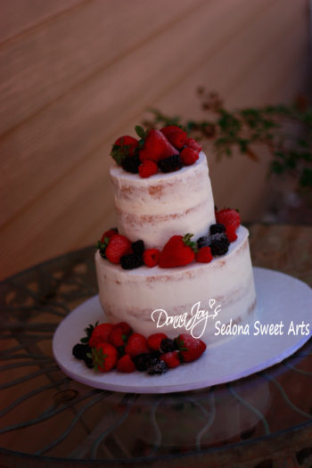 Naked wedding cake with berries