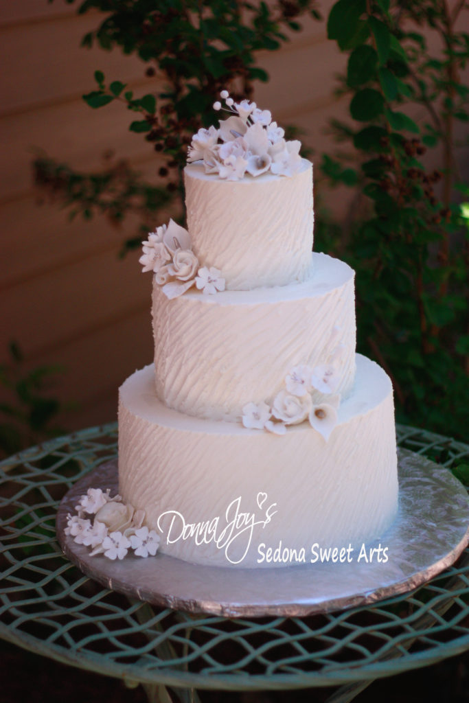 Buttercream Wedding Cake angled texture with hand sculpted sugar flowers by Donna Joy