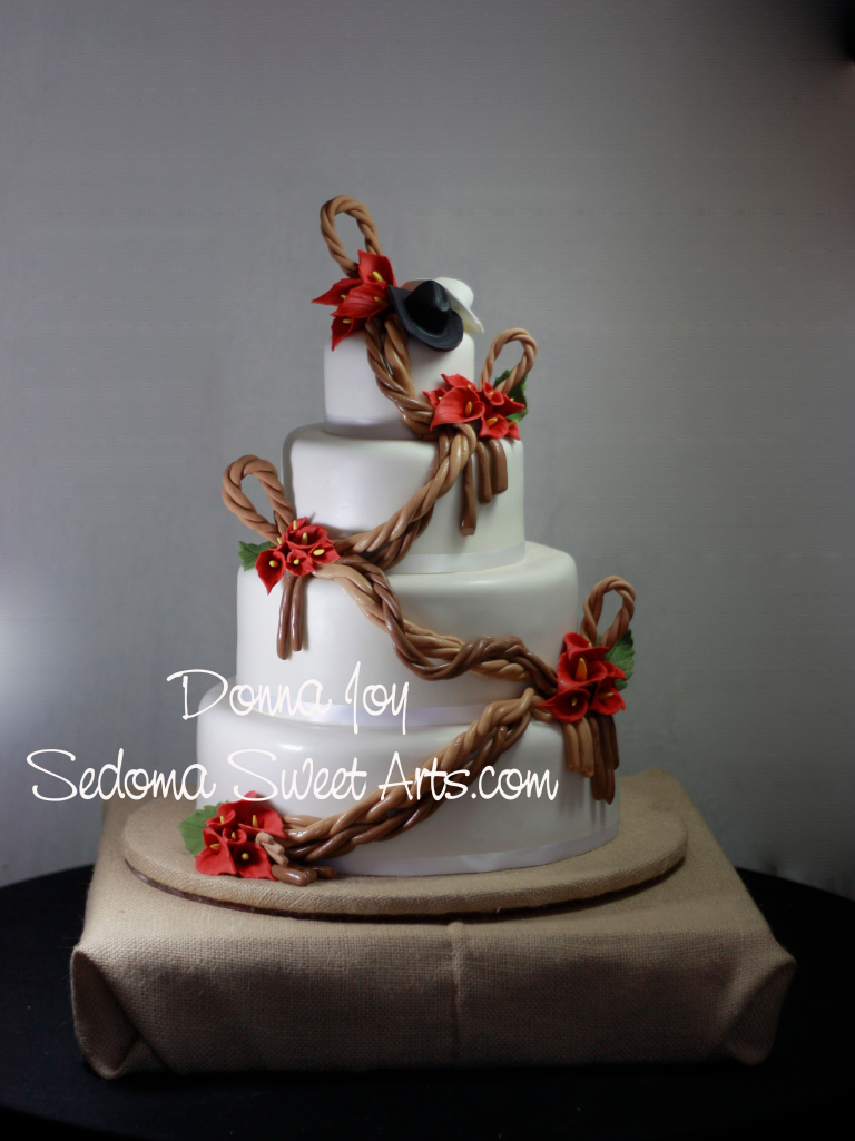 Custom Cowboy Cowgirl Hat Custom themed wedding cake by pastry chef Donna Joy. Donna Joy's hand sculpted sugar lasso ropes, sugar cowboy hats, sugar calla lilies. 2011