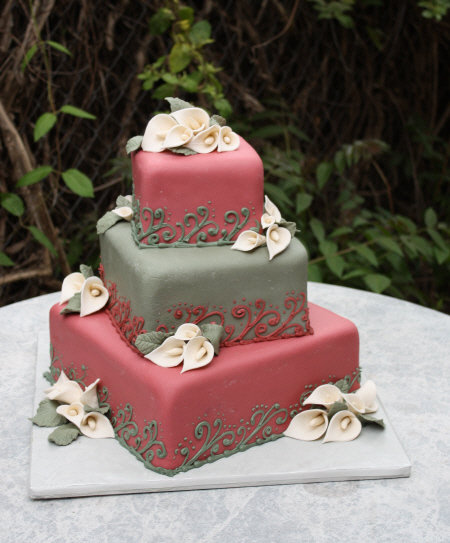 colorful Wedding Cake crested to match color swatches of the Bide. Adorned with Donna Joys white sugar calla lilies and textured sugar leaves.
♥ Donna Joy 