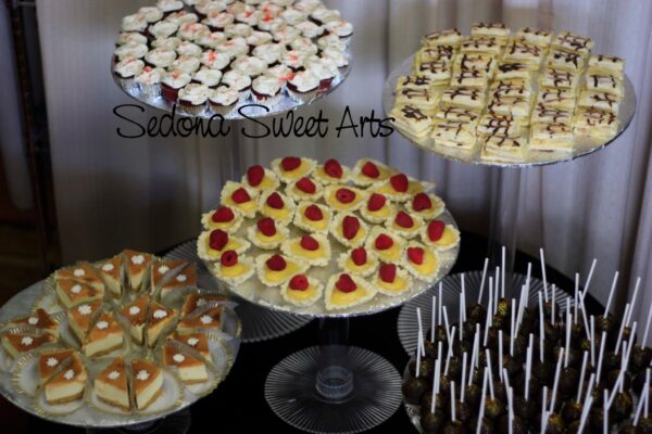 Dessert table cake pops, cheesecake bites, eclairs, mini lemon curd tarts, even mini napoleons 2012