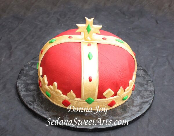 Kings cake, red velvet was the cake, hand painted gold the bands on top. 2011