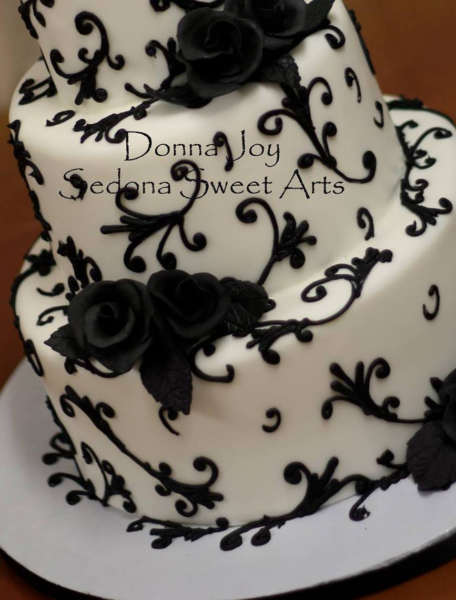 Fondant Drama Cake with black swirls and black sugar roses